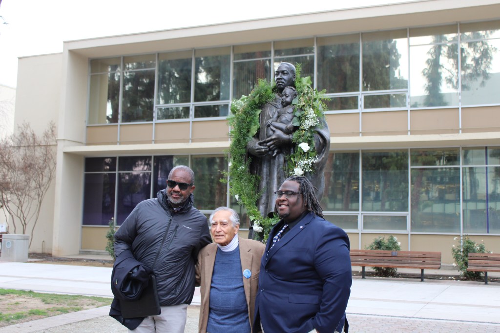 Mitchell stands with Kapoor and Blathers in front of the Martin Luther King Jr. statue in Fresno State's Peace Garden
