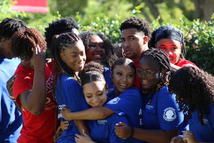students huddled together during a group activity
