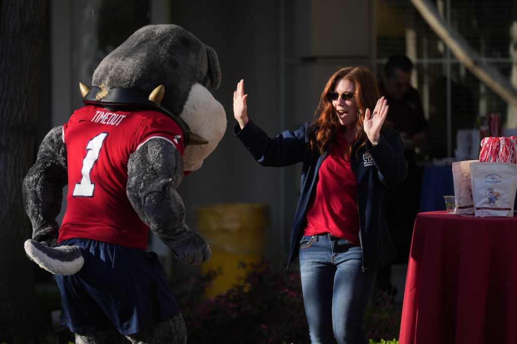 staff member dancing with TimeOut mascot